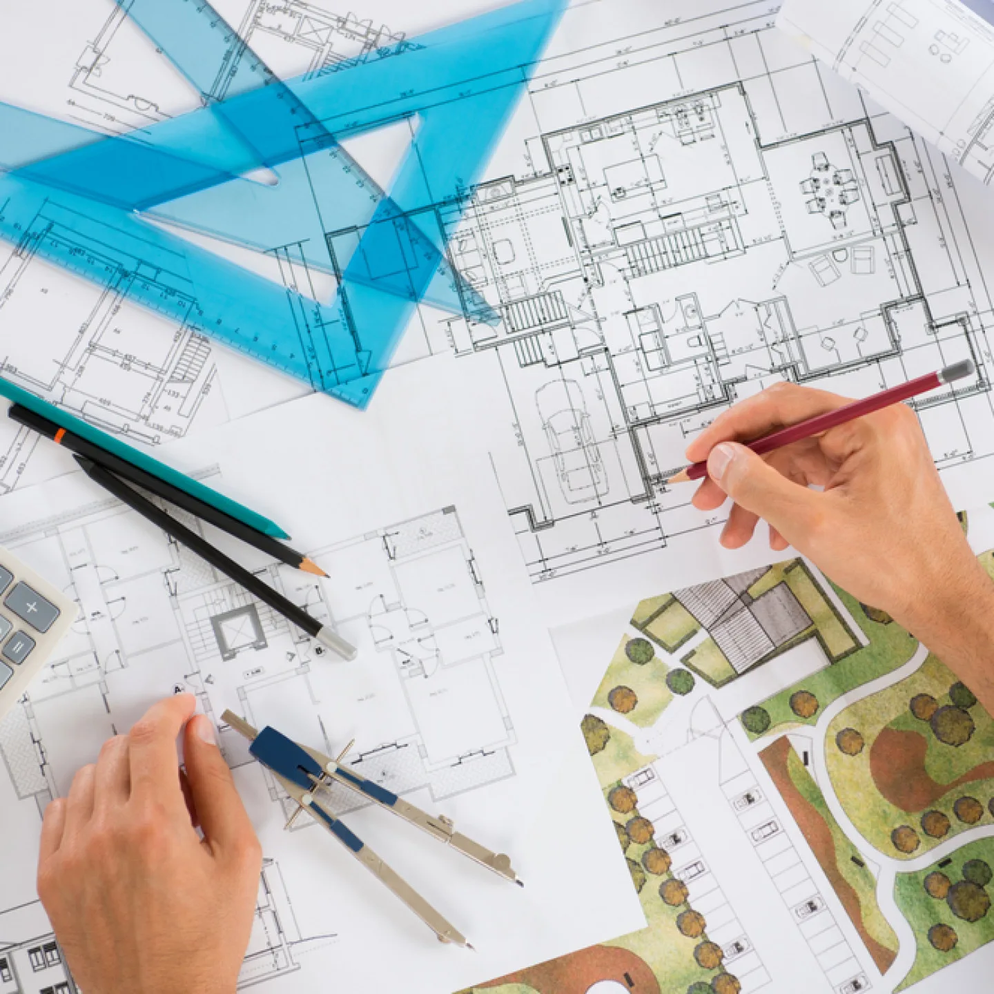 shutterstock_164241464_1579797213_i10240463497-2 Architect hands over blueprints